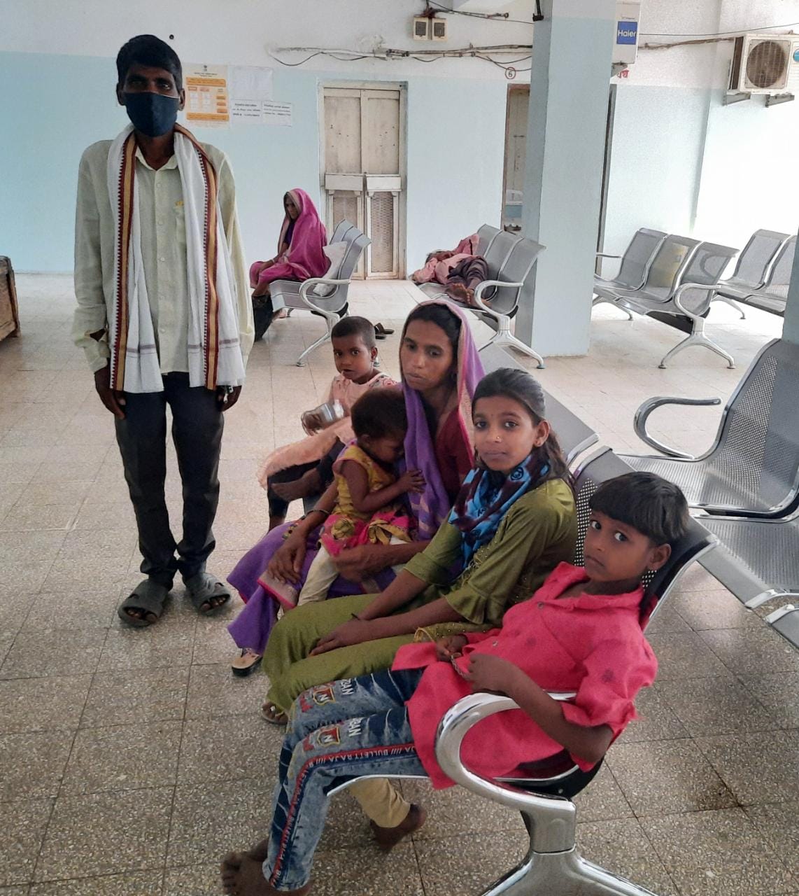 Low-cost healthcare helped save Bonda's life. Bonda is pictured at Chinchpada with his wife and 4 children.
