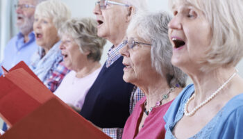 Group Of Seniors Singing In Choir Together Host a choral concert at your church or a local venue