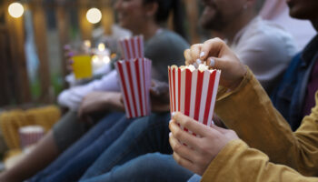 young-friends-having-fun-cinema-open-air Host a movie night*