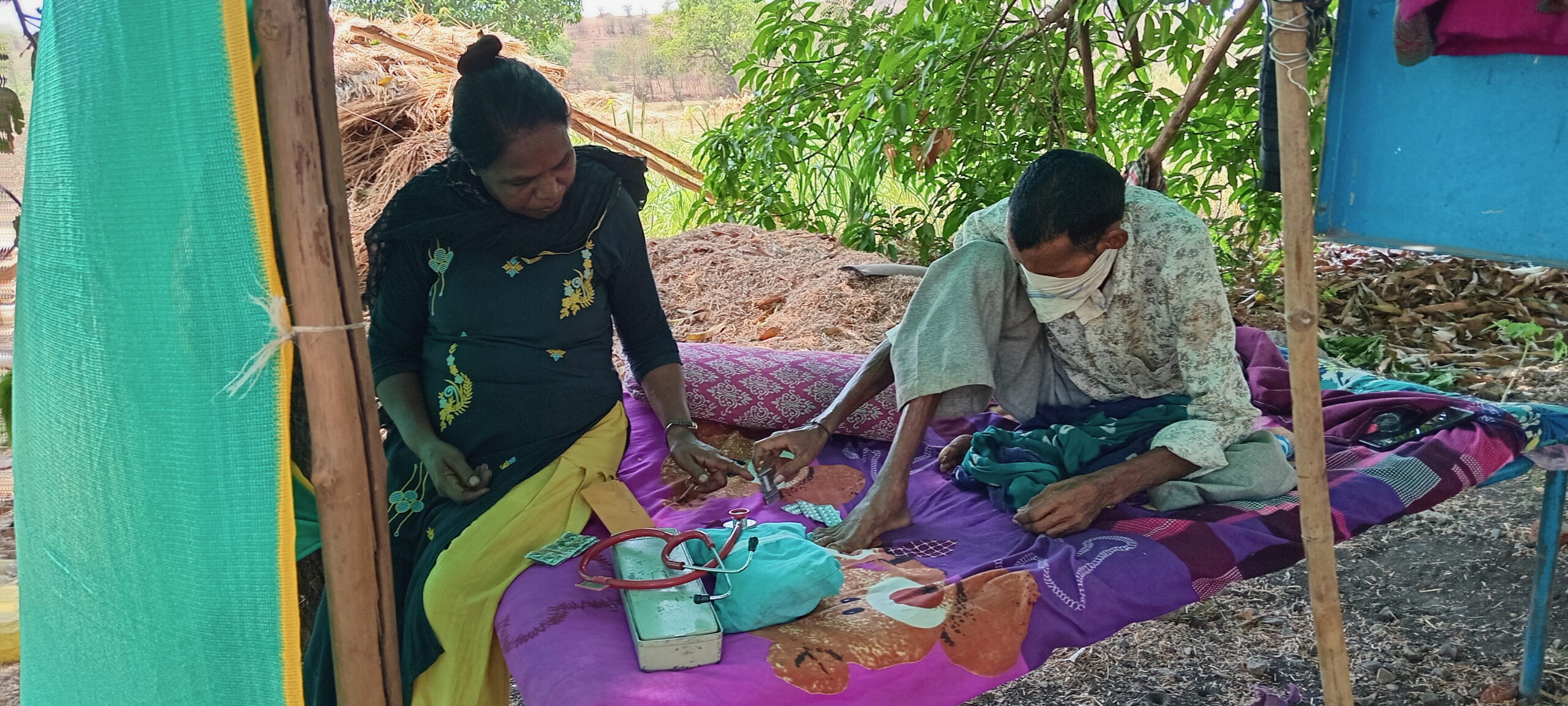 Suresh, a terminal cancer patient, being treated by a member of the CCH palliative care team.